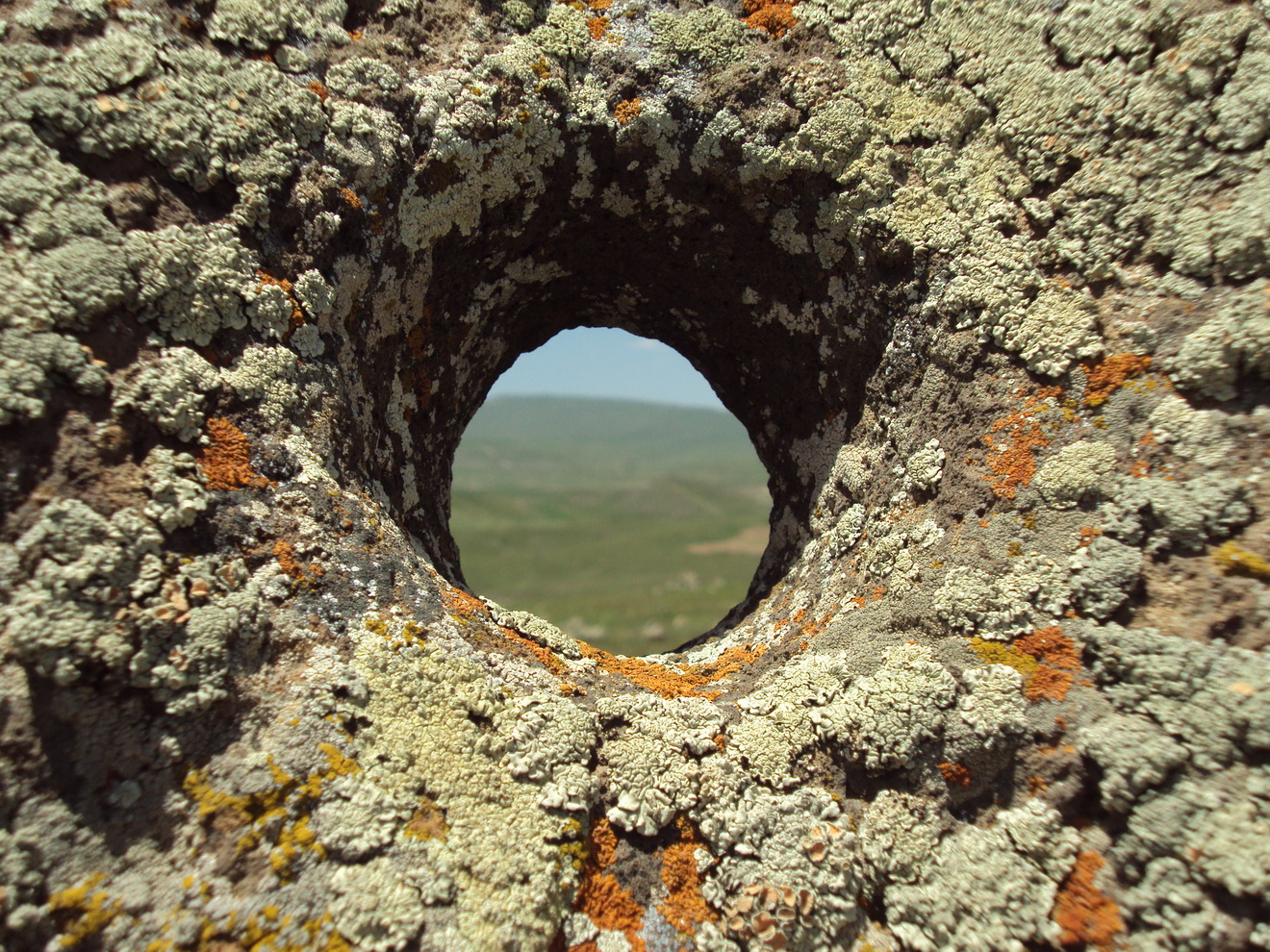 Weathered standing stones of Karahunj under an open Armenian sky