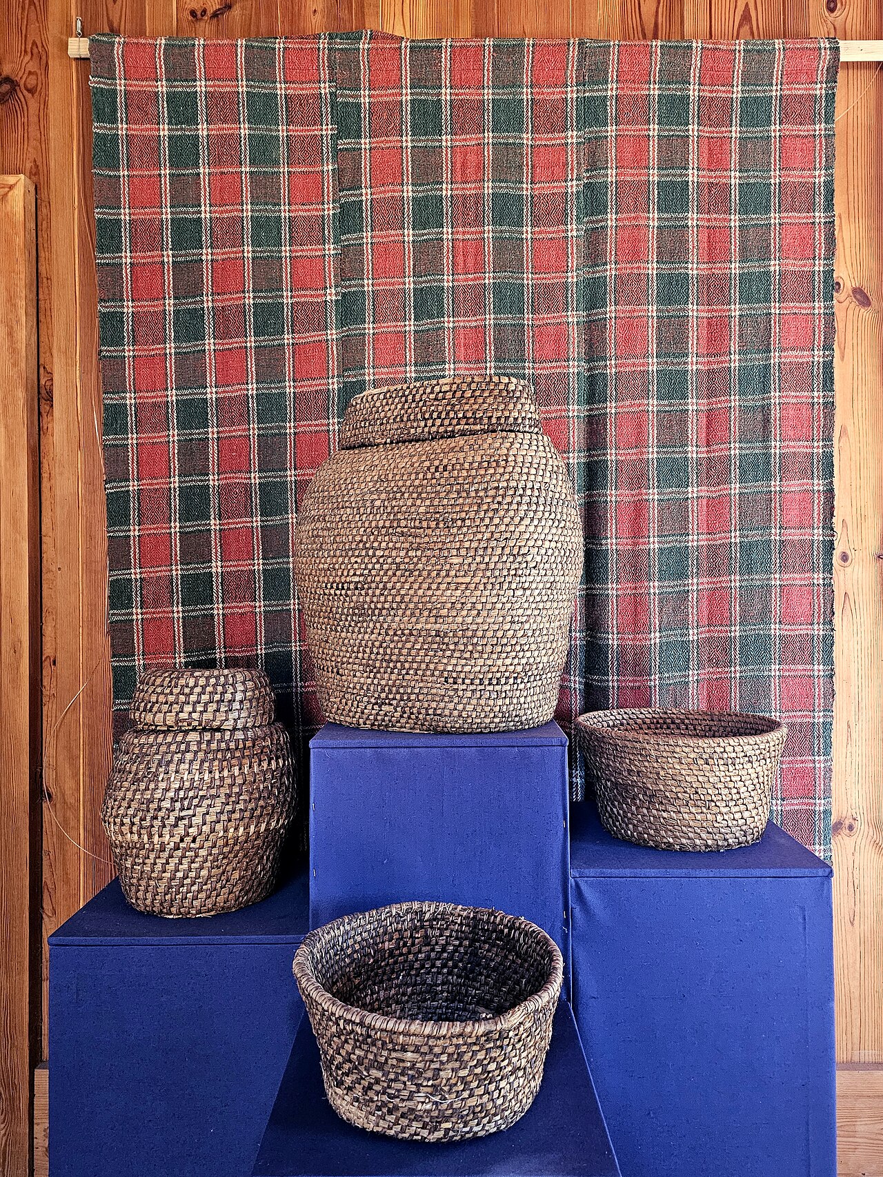 A traditional wooden church and folk architecture at a Belarusian open-air museum