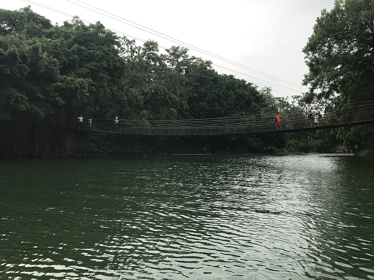A reconstructed Derung cane-and-rope bridge shown at the China Folk Culture Village