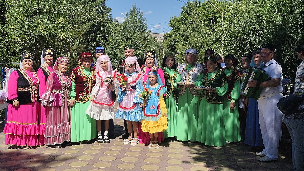 A group in Tatar national costume, the dress shared by the Tatars of China