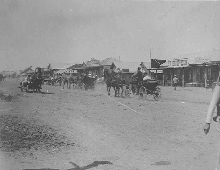 Horse-drawn carts in a Russian village around 1905, an image of the old rural life