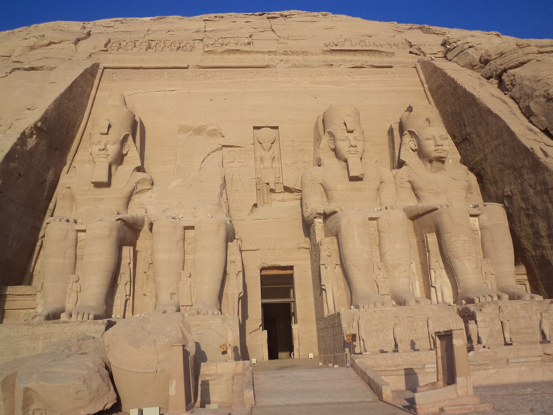 A side view of the Great Temple, showing the scale of the Nubian sandstone cliff it was cut from.
