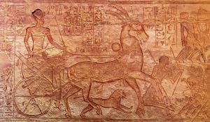 Carved reliefs inside Abu Simbel celebrating the military campaigns of Ramesses II.
