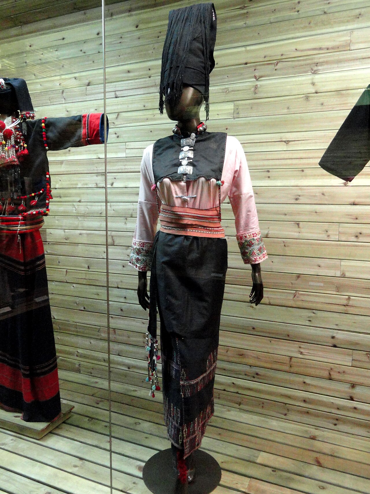 An Achang woman in brocade dress