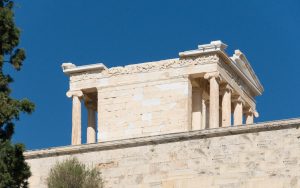 The small Temple of Athena Nike perched at the edge of the Acropolis.