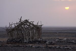 A nomadic hut in the Danakil Desert, where Afar families gather.