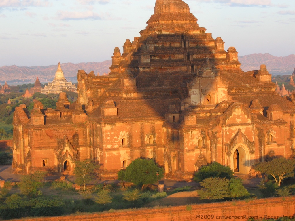 Hot-air balloons drifting over the temples of Bagan at dawn.