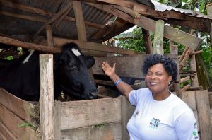 A woman of southwestern Uganda with her cow; the Banyankole speak Runyankole.