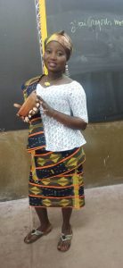 A Baoulé woman in kita cloth with a calabash; the Baoulé are the largest people of Côte d'Ivoire.