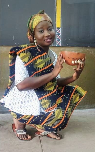 A Baoulé woman in traditional dress; the people speak Baoulé, an Akan language.