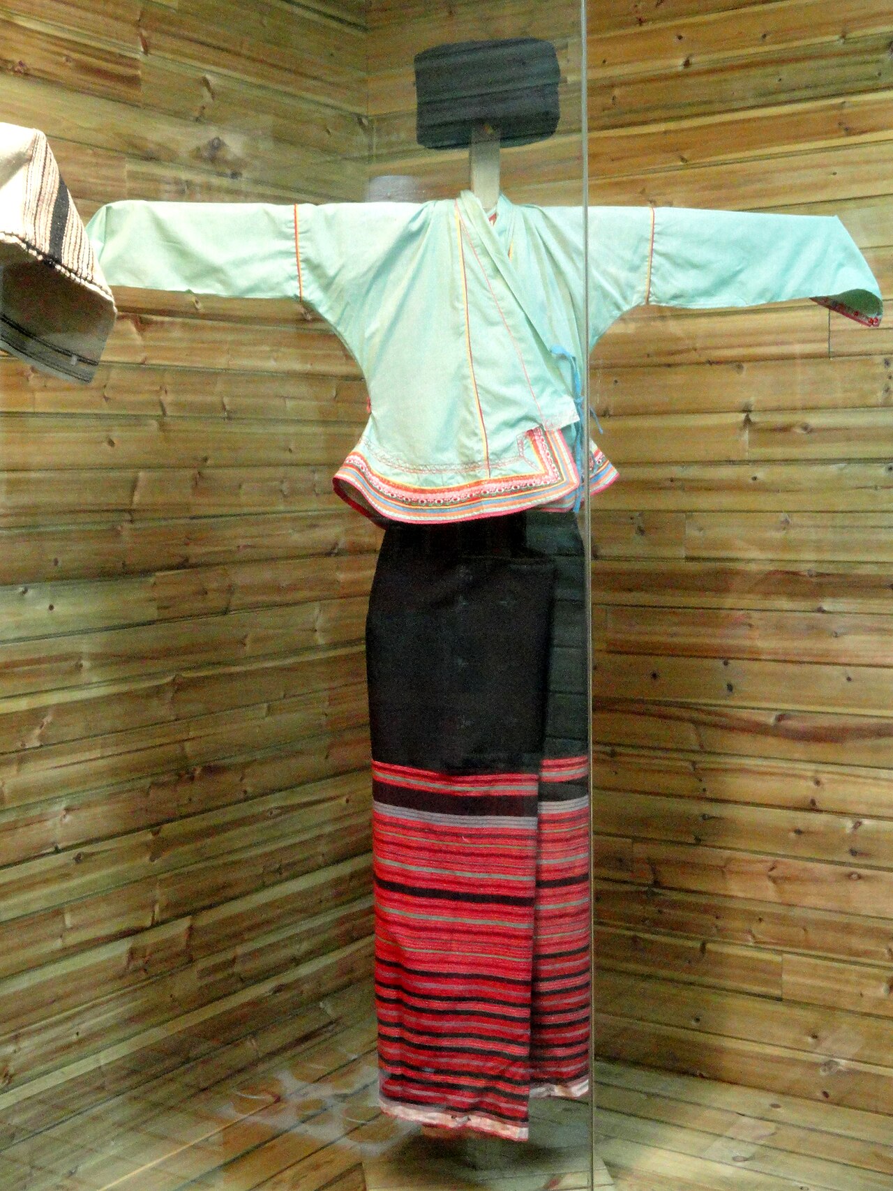 A Blang woman in brocade dress