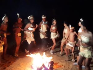 Damara people dancing around a fire.