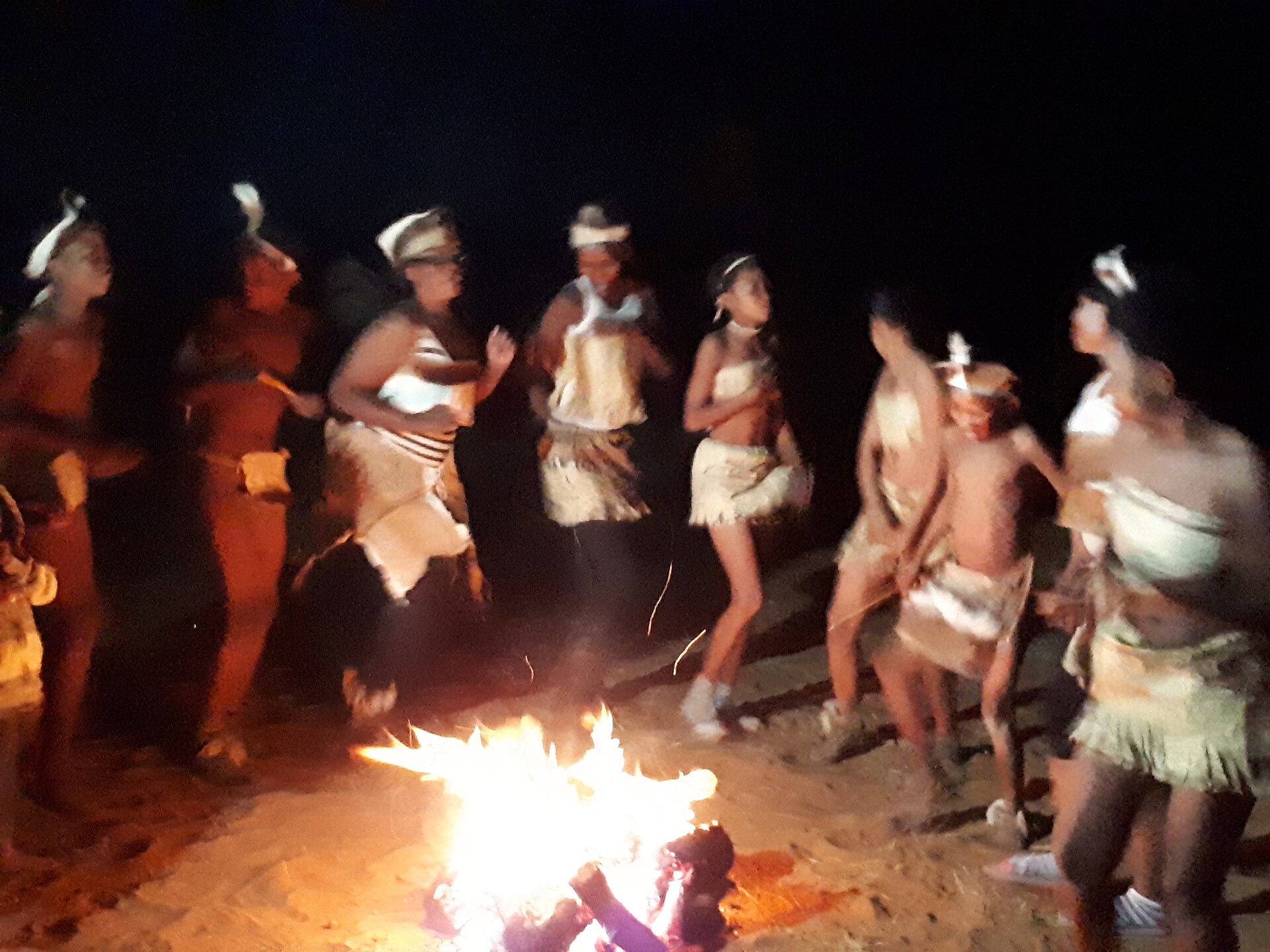Damara people dancing around a fire.