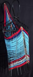 The beadwork of a Dinka man's ornament