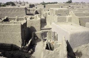The minaret towers and spiked beams of the Great Mosque of Djenne.