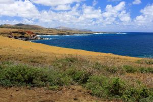 The remote volcanic coastline of Easter Island in the South Pacific.