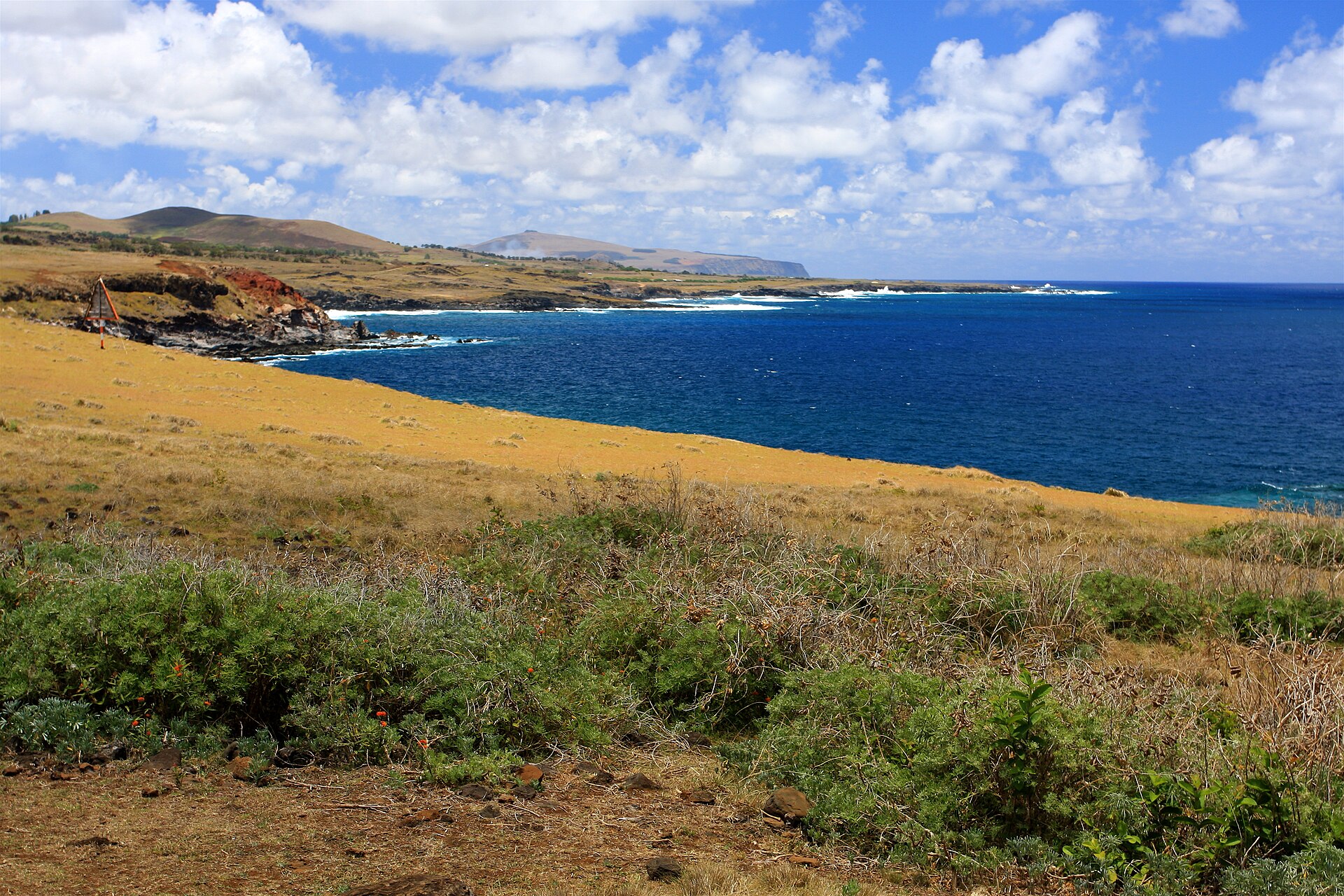 The remote volcanic coastline of Easter Island in the South Pacific.