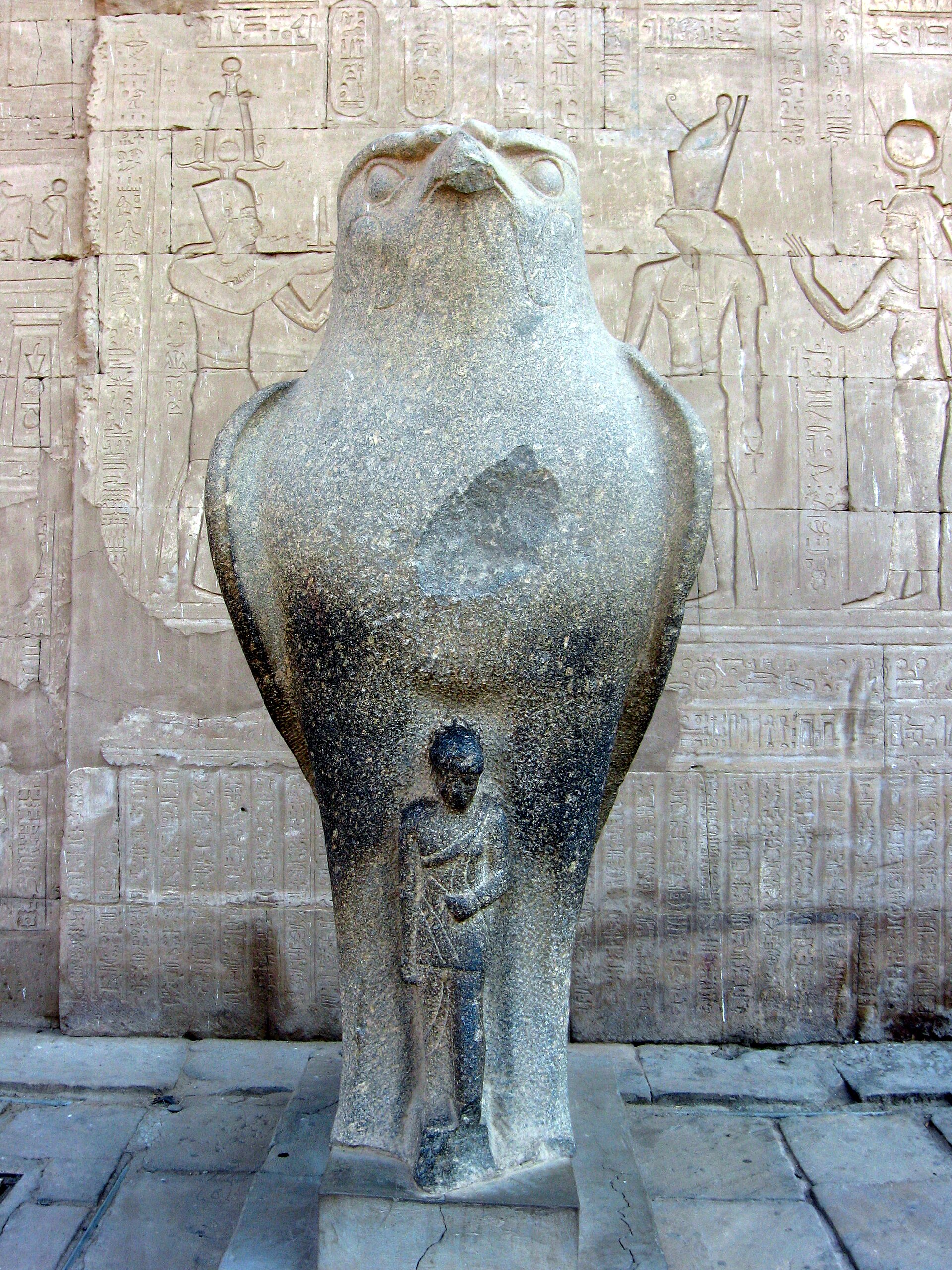 A granite falcon statue of the god Horus guarding the temple of Edfu.