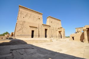 Colossal reliefs of the king before the gods on the pylon of Edfu.