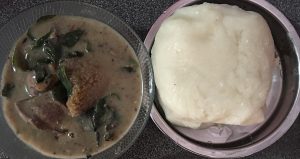 White soup with pounded yam, a dish of the Edo and southern Nigeria.
