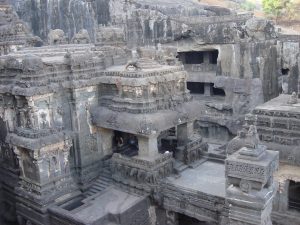 Carved stone elephants supporting the base of the Kailasa Temple.