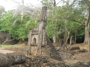 A carved pillar tomb at Gedi, a distinctive feature of the Swahili coast.