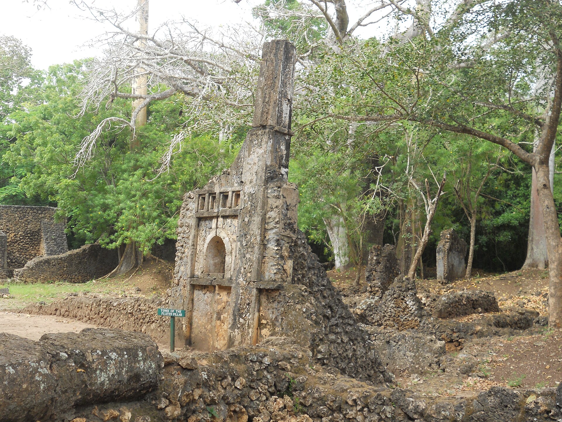 A carved pillar tomb at Gedi, a distinctive feature of the Swahili coast.