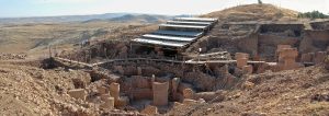 The excavated enclosures of Gobekli Tepe beneath their protective roof.