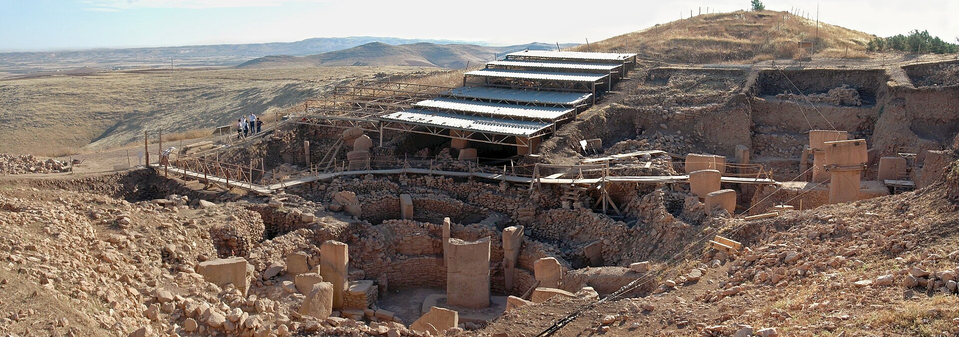 The excavated enclosures of Gobekli Tepe beneath their protective roof.