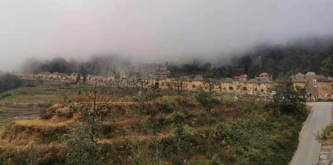 The Hani folk village of Qingkou, with its sacred groves and ancestor worship