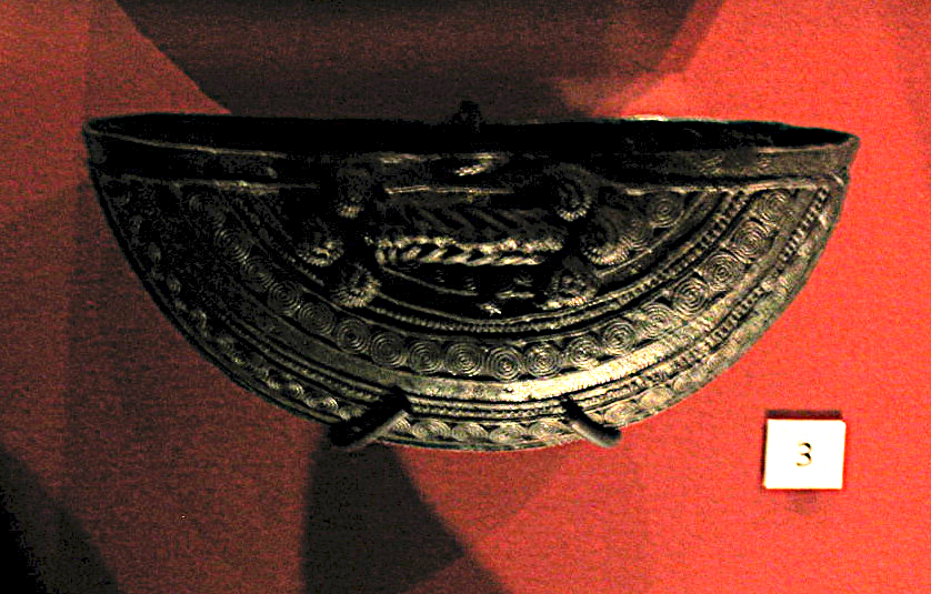 An intricately worked Igbo-Ukwu vessel, its surface covered in fine simulated wirework