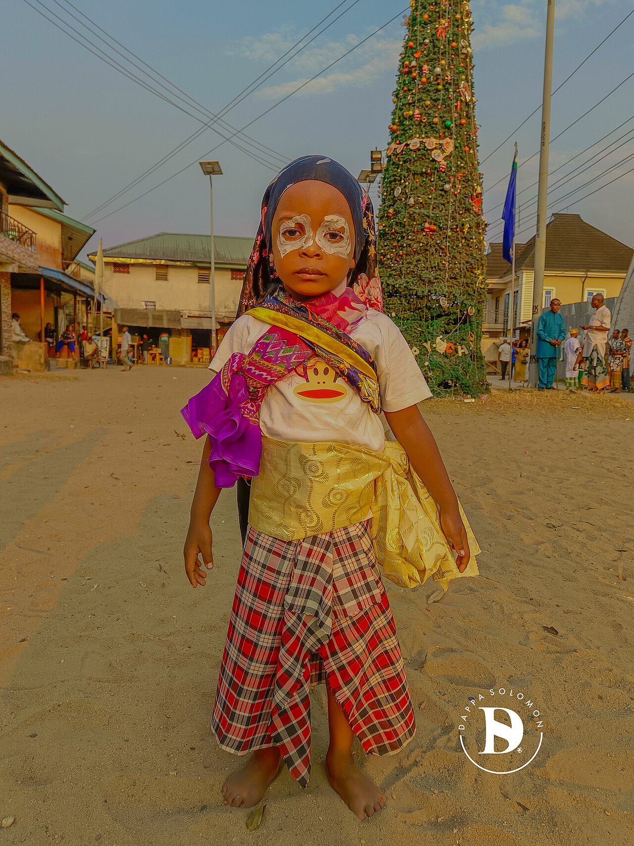 A young masquerade dancer; masquerades are central to Ijaw community life.