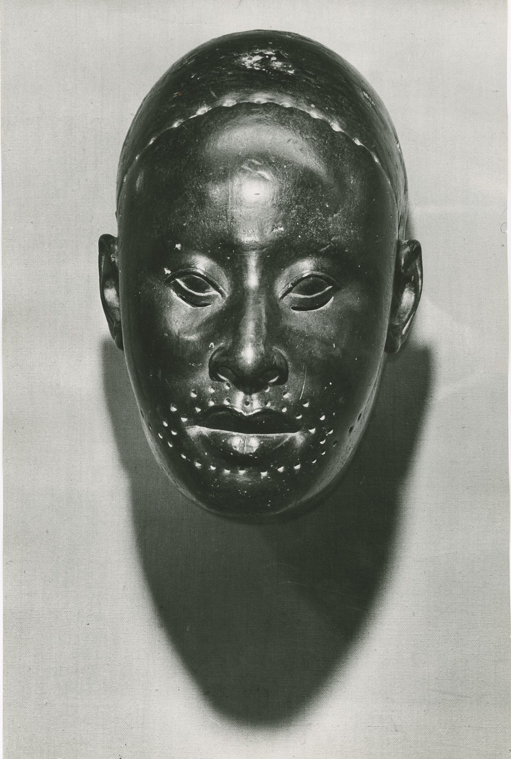 The copper mask traditionally identified with Obalufon II, a masterpiece of Ife portraiture
