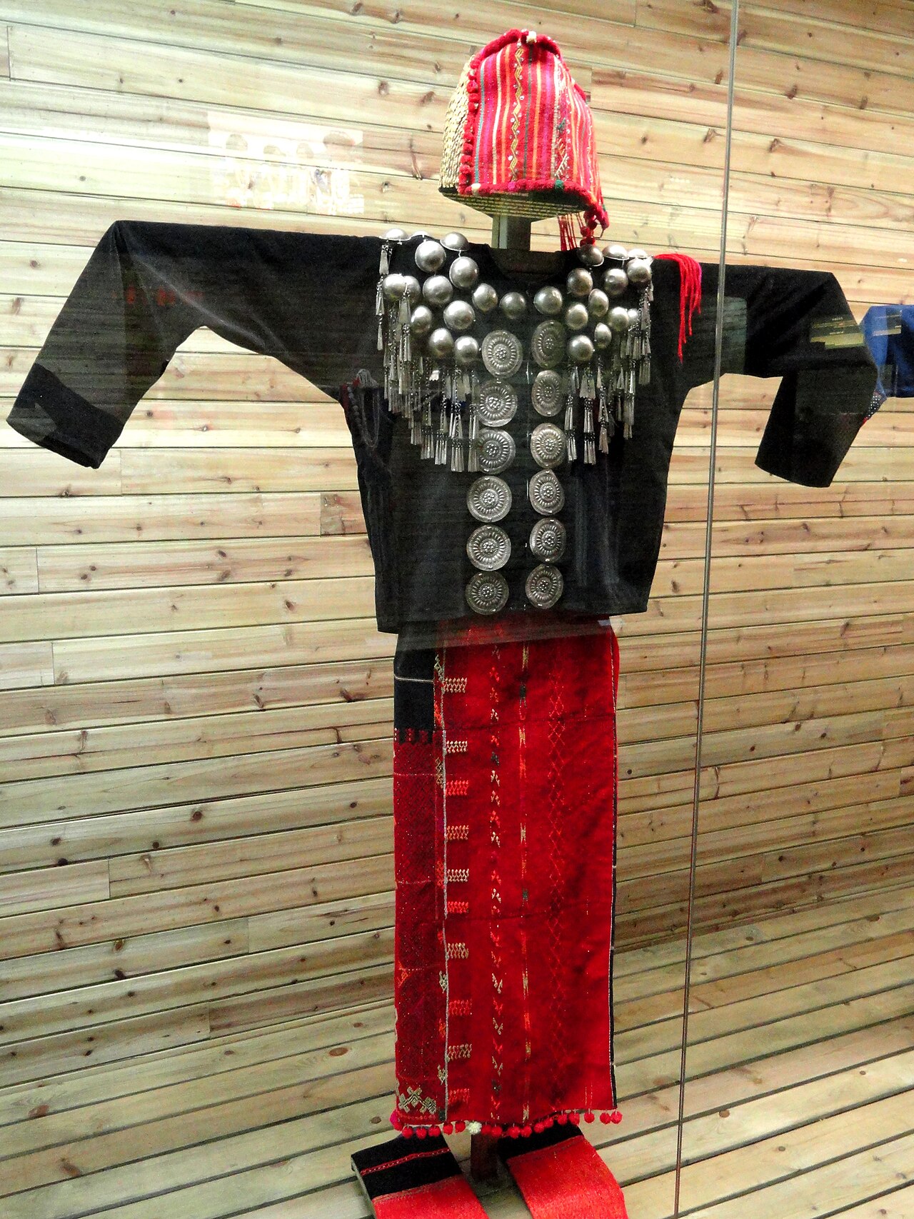 A Jingpo woman in silver-ornamented dress
