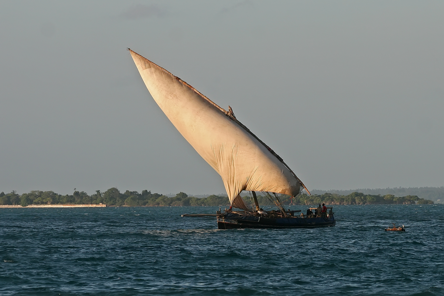 A lateen-rigged dhow on the Indian Ocean, the kind of vessel that carried Kilwa's trade with monsoon winds