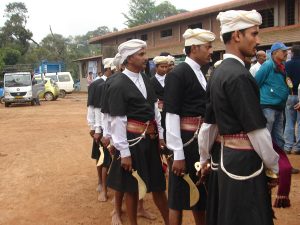 Young Kodava men with the traditional weapons of their martial culture