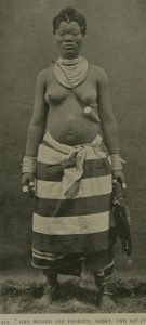 A Kru woman in traditional dress and adornment.