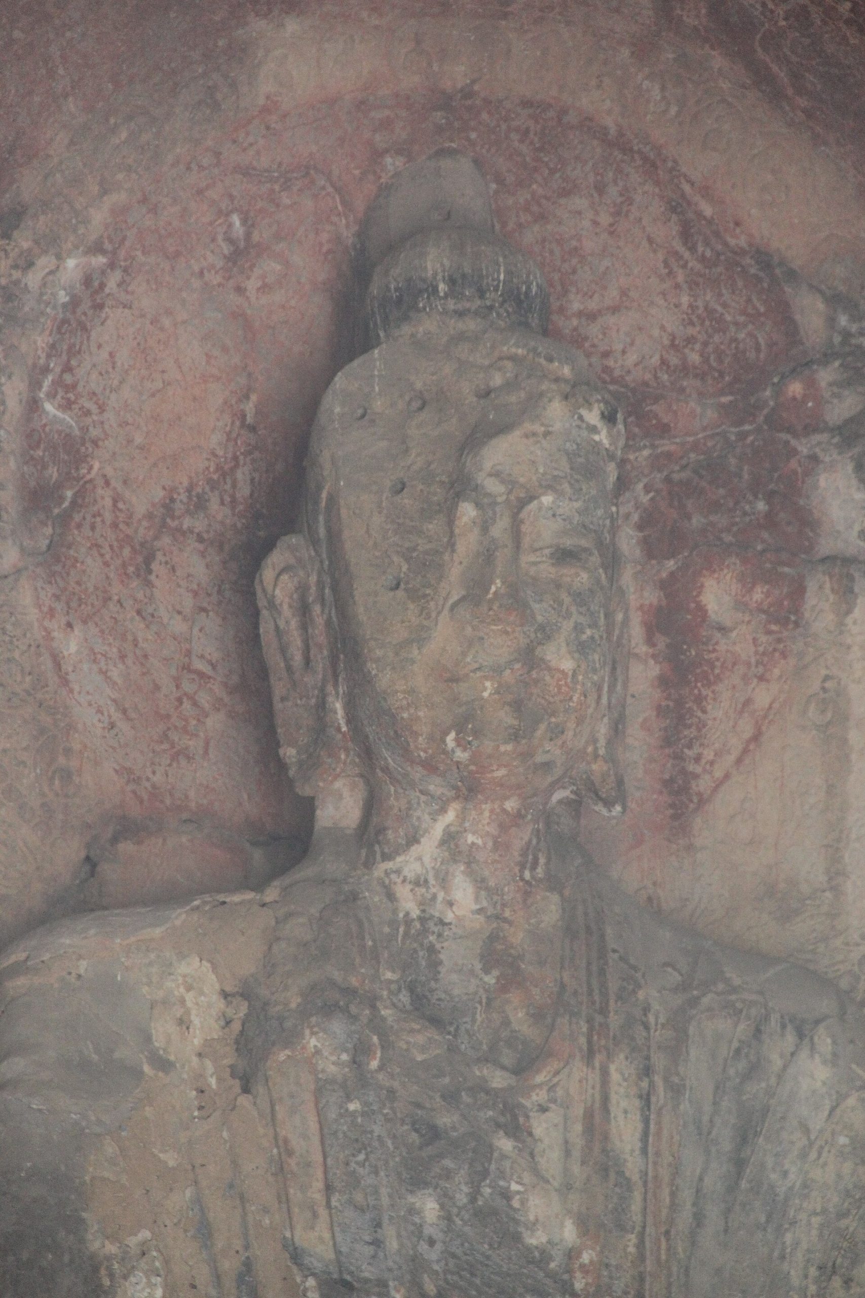 The serene face of the great Vairocana Buddha at Longmen.