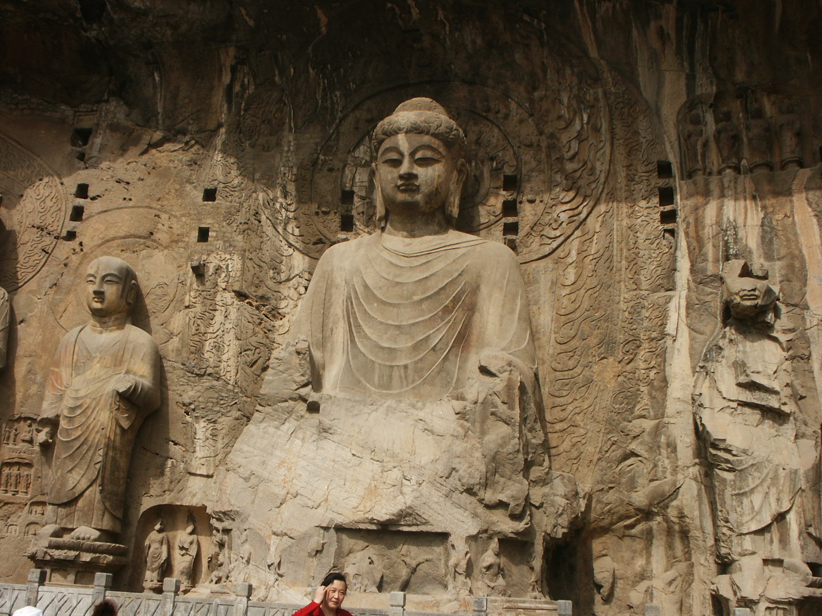 The colossal Vairocana Buddha of the Fengxian Cave at the Longmen Grottoes.