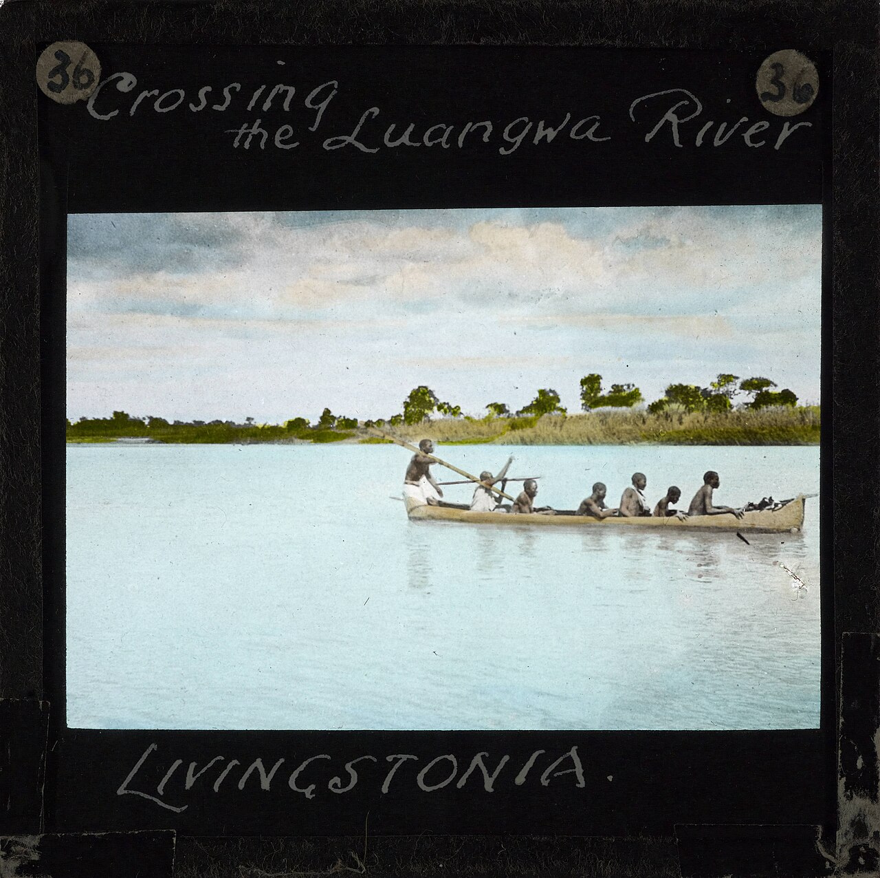 A dugout canoe on a Zambian river; canoe-building is a key Lozi craft.