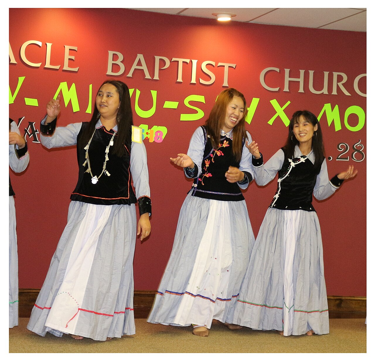 Young Lisu women dancing