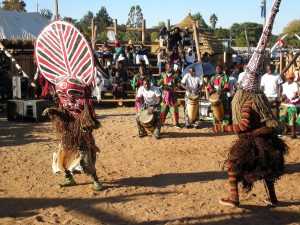 Makishi dancers in performance at a Central African ceremony.