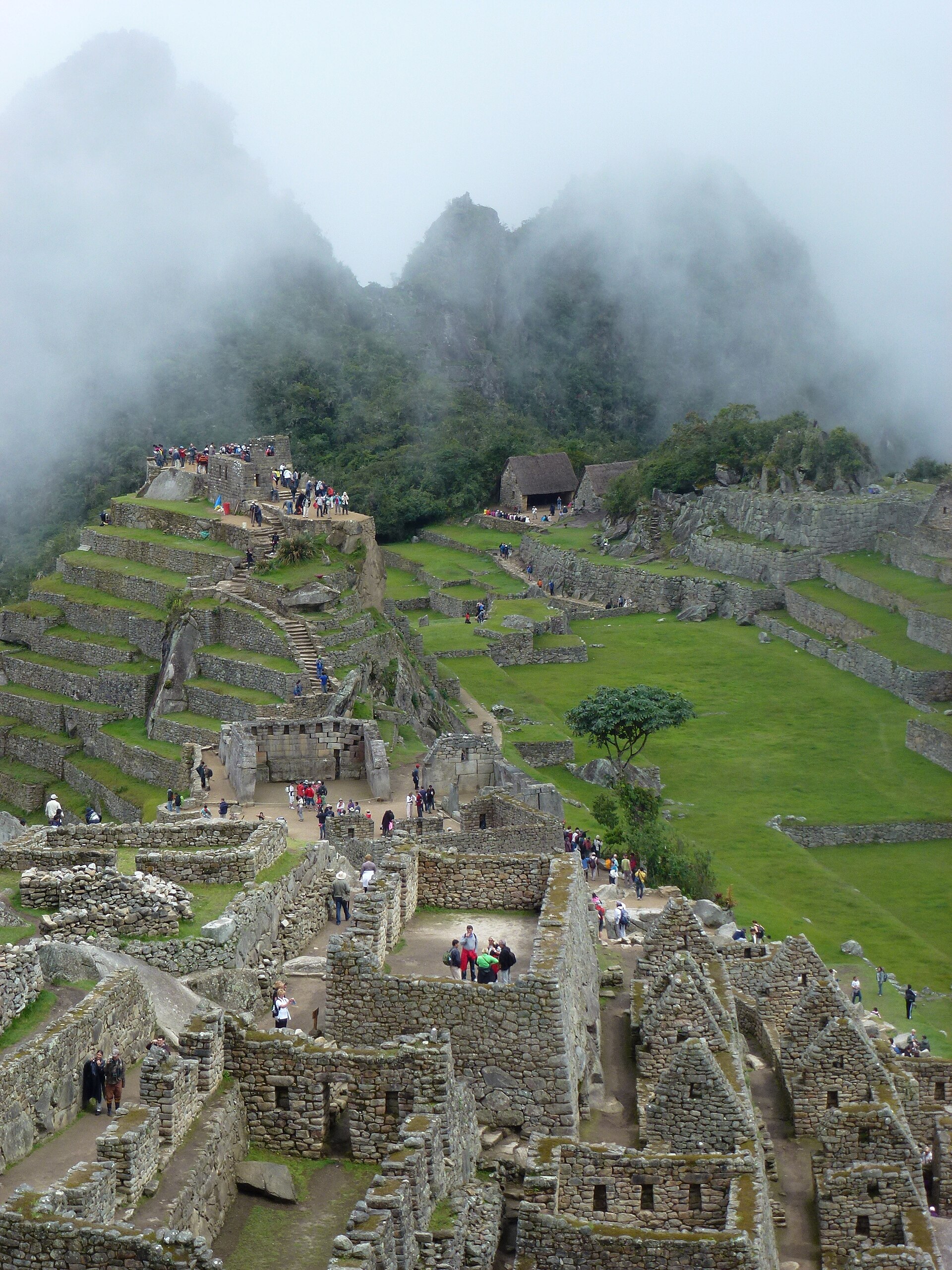 Machu Picchu wreathed in Andean cloud, perched on a ridge high above the Urubamba valley