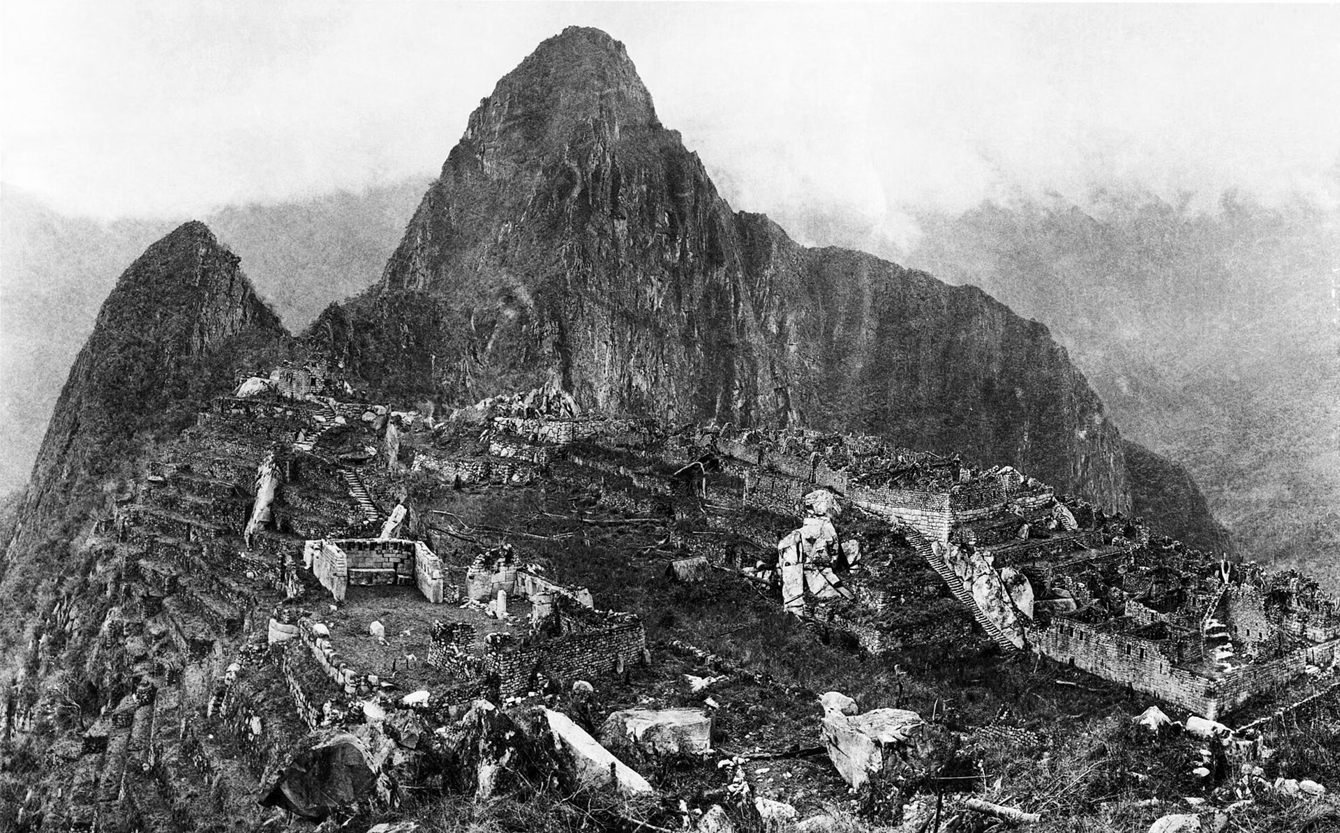 Temples and plazas of Machu Picchu spread along the mountain ridge