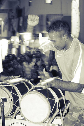 A performer of bodu beru, the great drum music of the Maldives