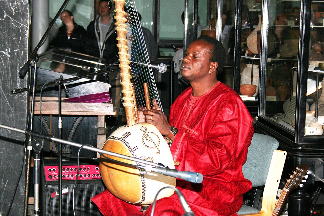 A jali, or griot, playing the kora, the great tradition of Mande music.