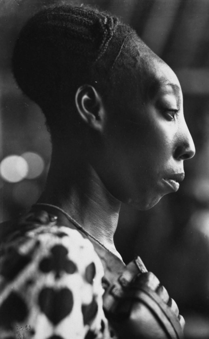 A Mangbetu woman; the Mangbetu speak a Central Sudanic language.