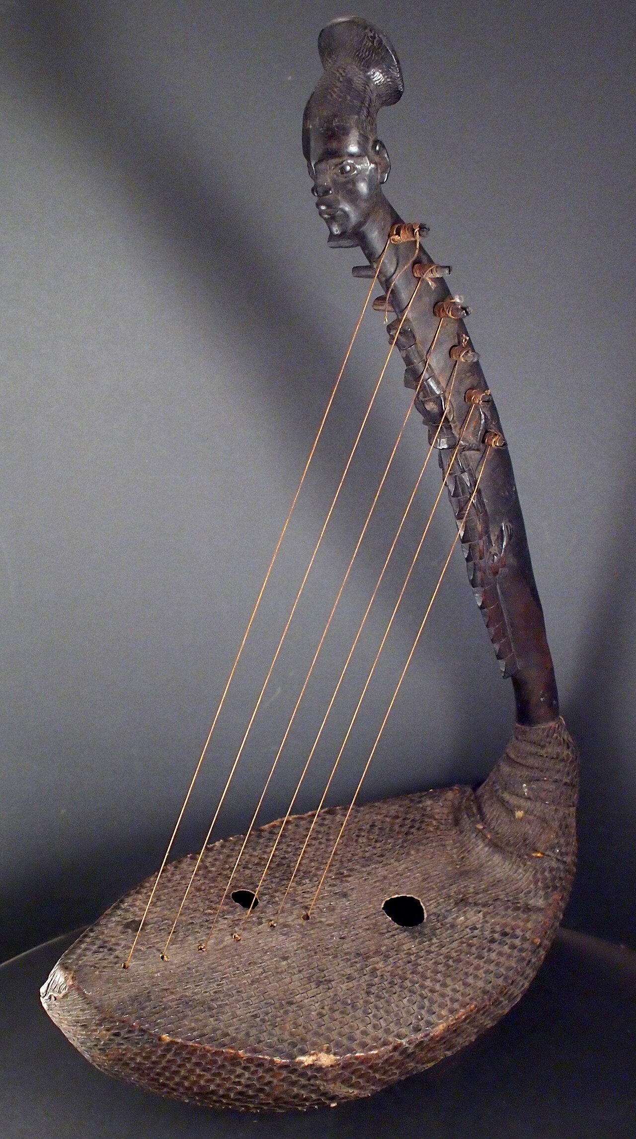 A finely carved Mangbetu harp, famed for its human-headed neck.
