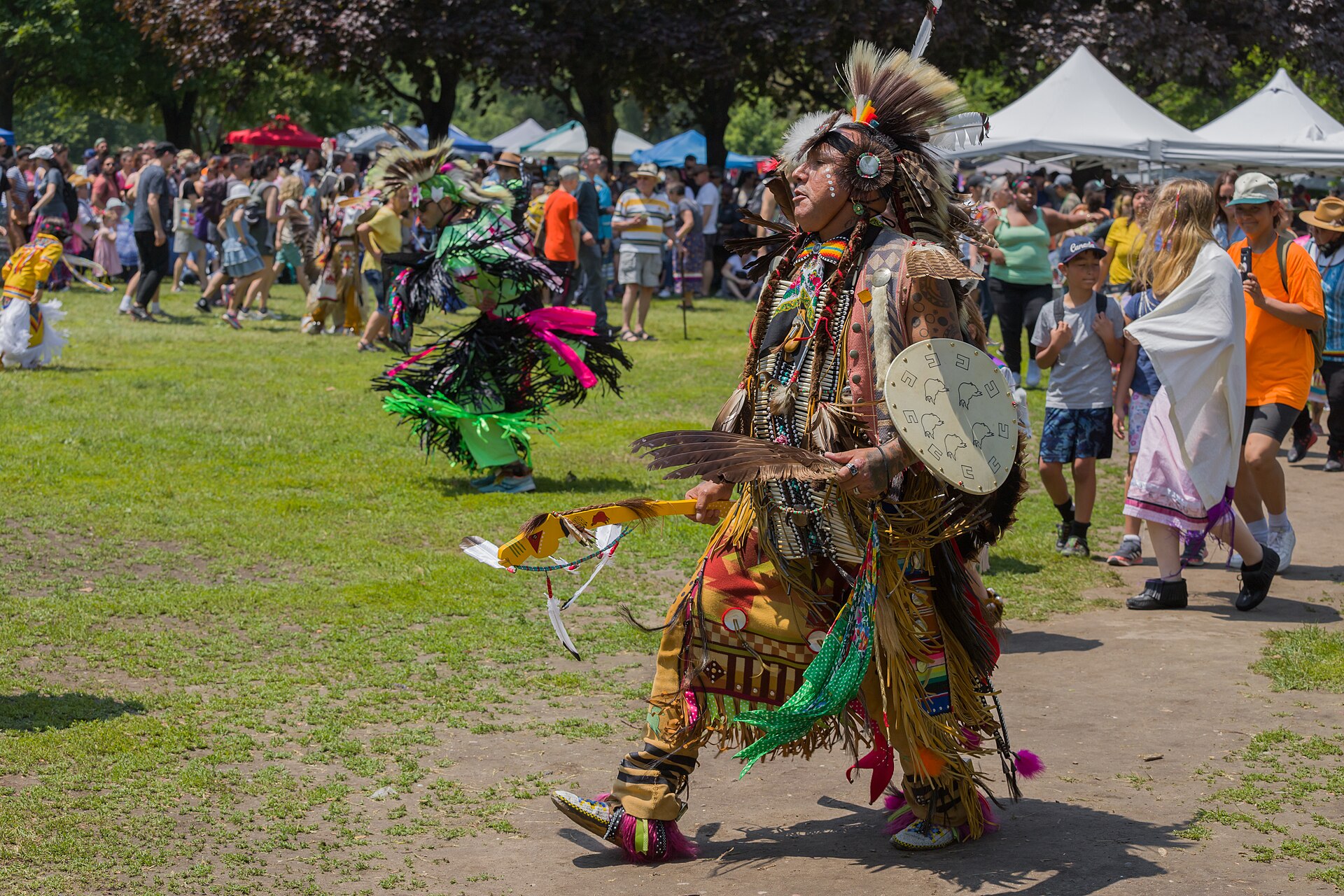 Dancers at a powwow, a gathering of song, dance and regalia.