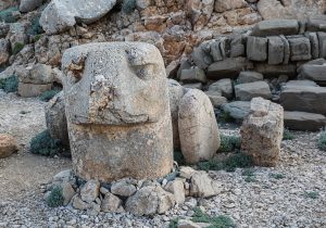 The colossal stone heads of Mount Nemrut, scattered before an ancient royal tomb.